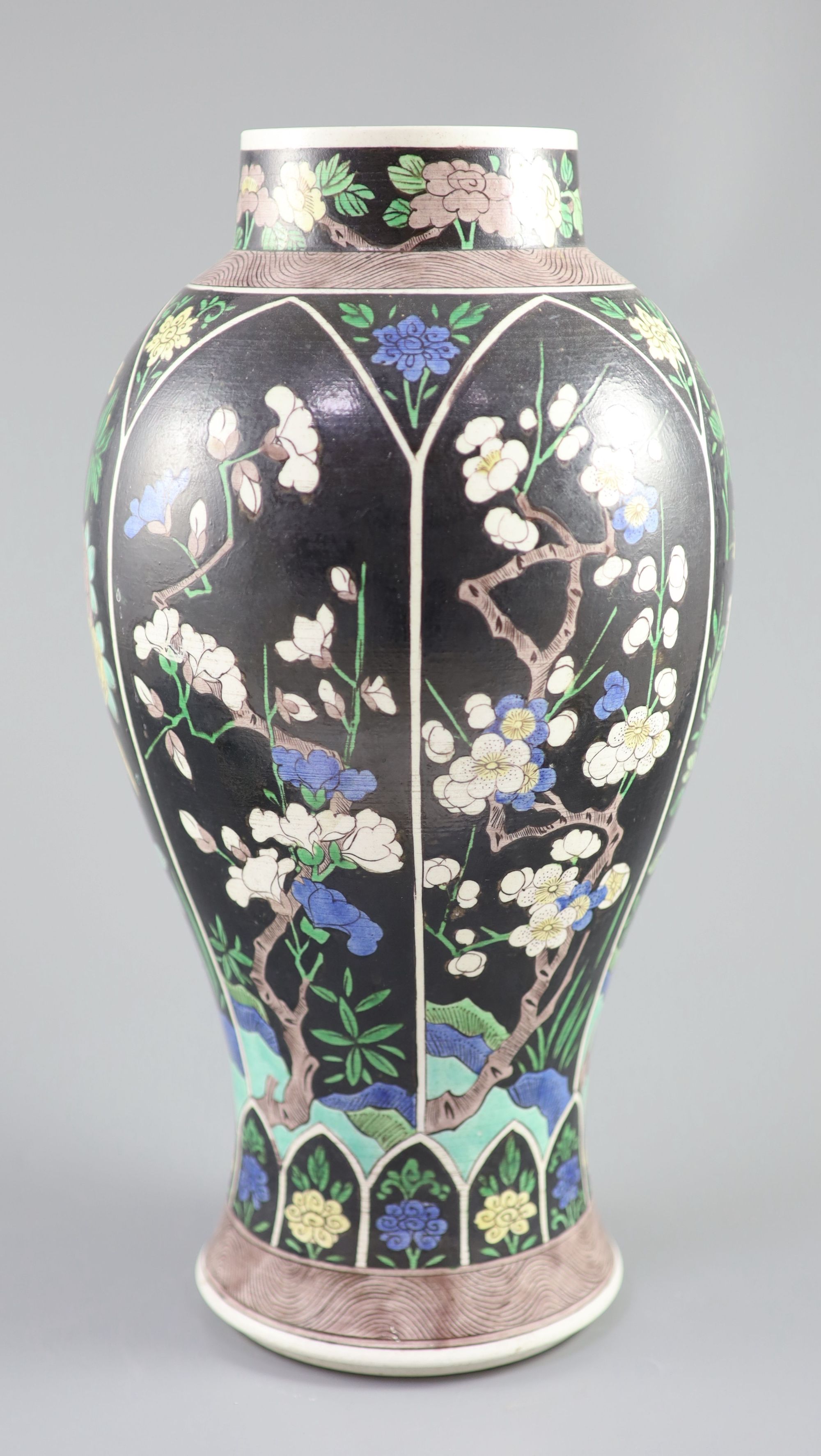 A Chinese famille noire enamelled biscuit baluster vase and cover, 19th century, 47cm high